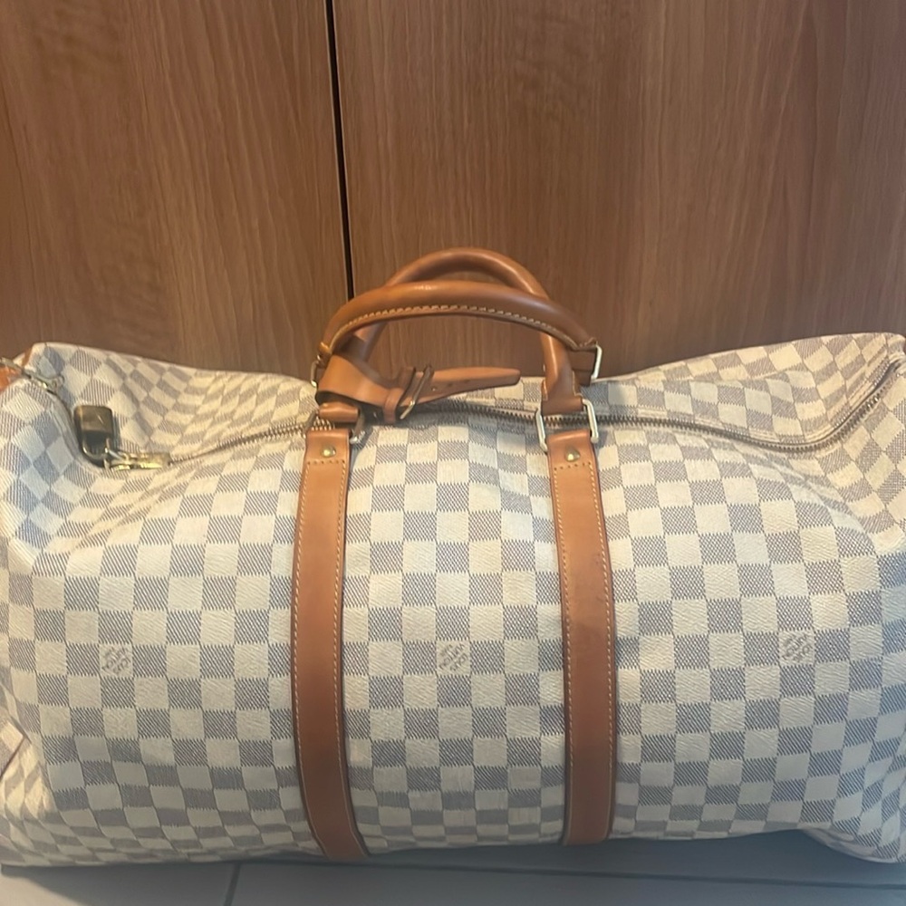 Louis Vuitton duffle luggage used as carry on